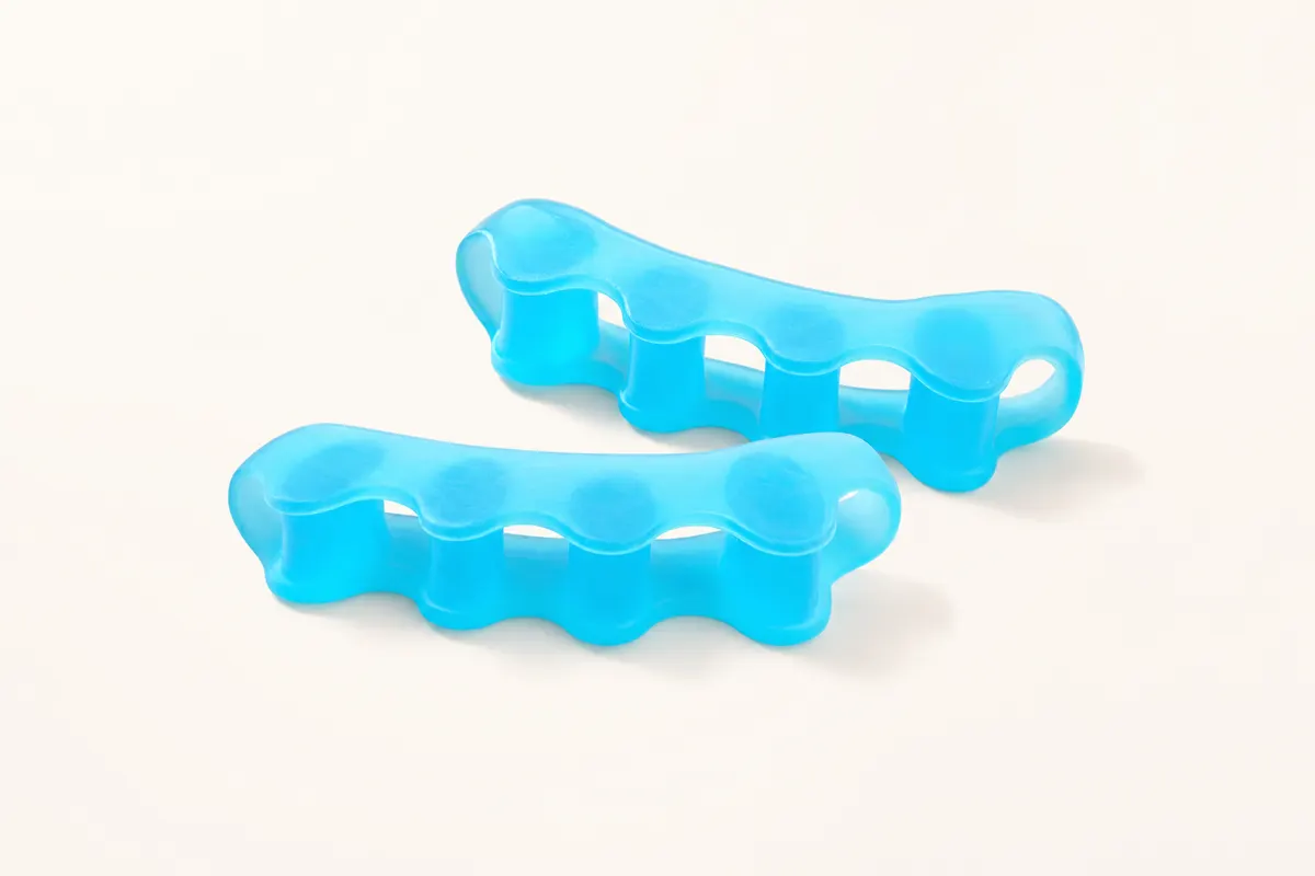 ToeRoom gel toe spacers and separator tubes arranged on a neutral background